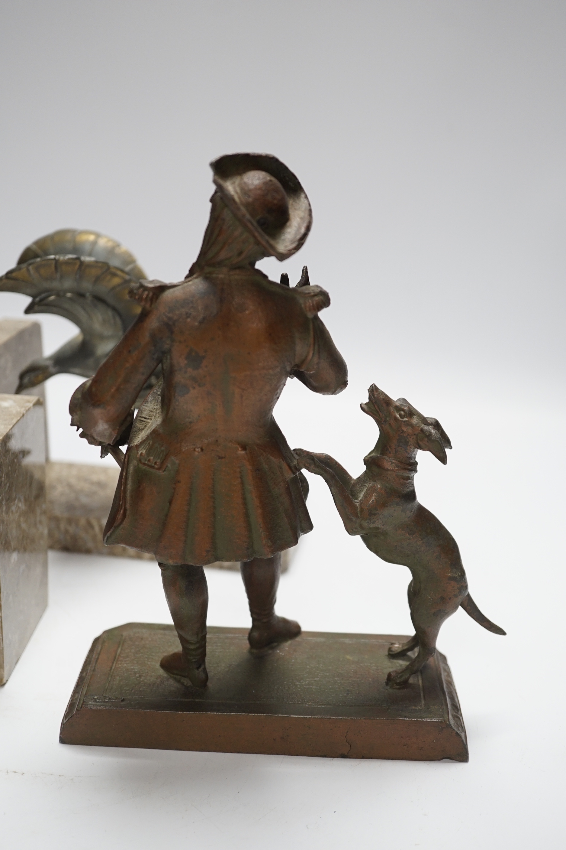 A pair of spelter eagle bookends and a figure with dog, figure 23cm high